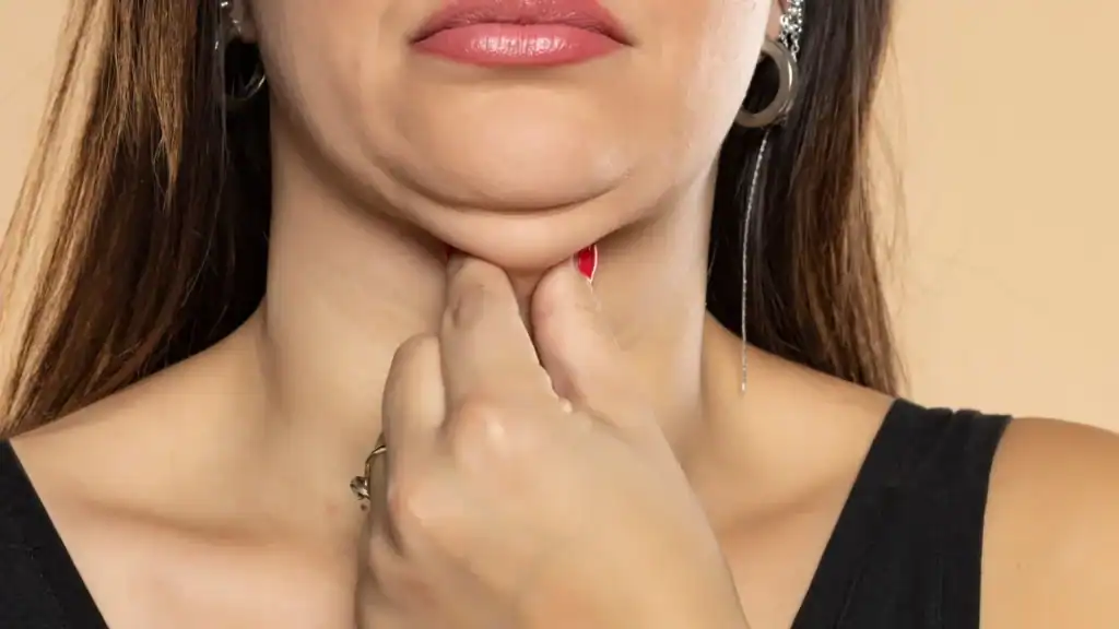 An image of a woman with double chin, sad, worried : Non Surgical Double Chin Removal Treatment in Bishops Stortford, UK